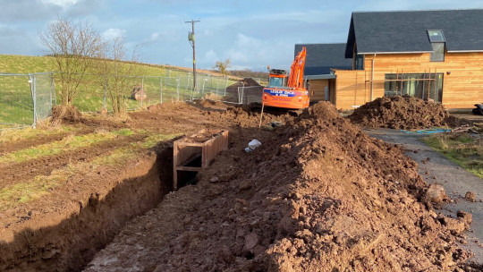 Working close to the buildings on the site