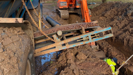 Digging new leader and laying twin-wall. Gravel cart putting in 40mm gravel